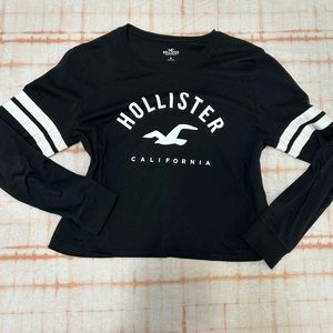 Hollister tee shirt black with writing white stripes on sleeves